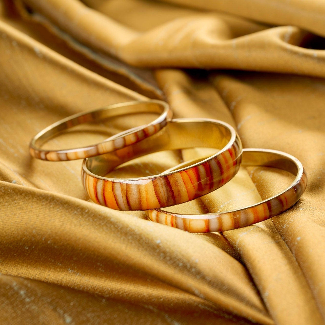 On Earth Guscio set 3 bracciali resina multicolore