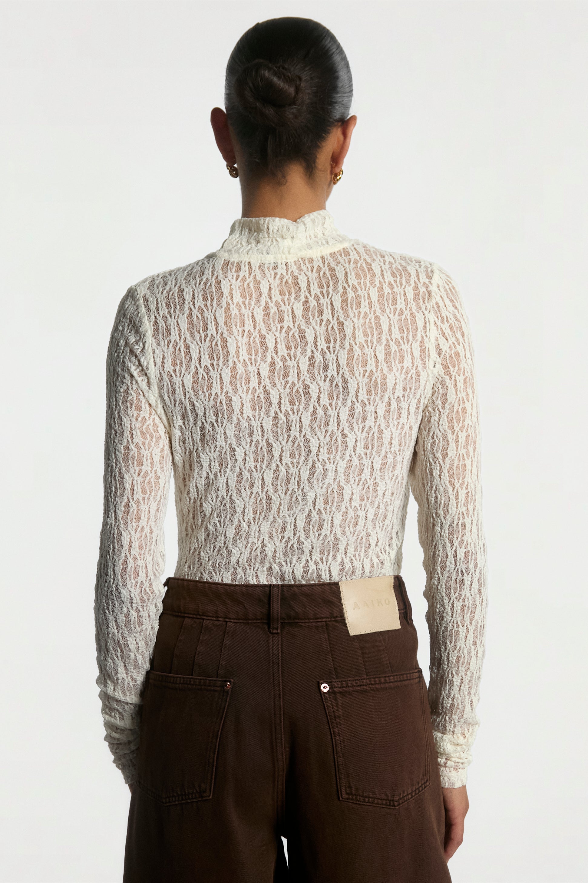 Aaiko Amy top crema collo alto